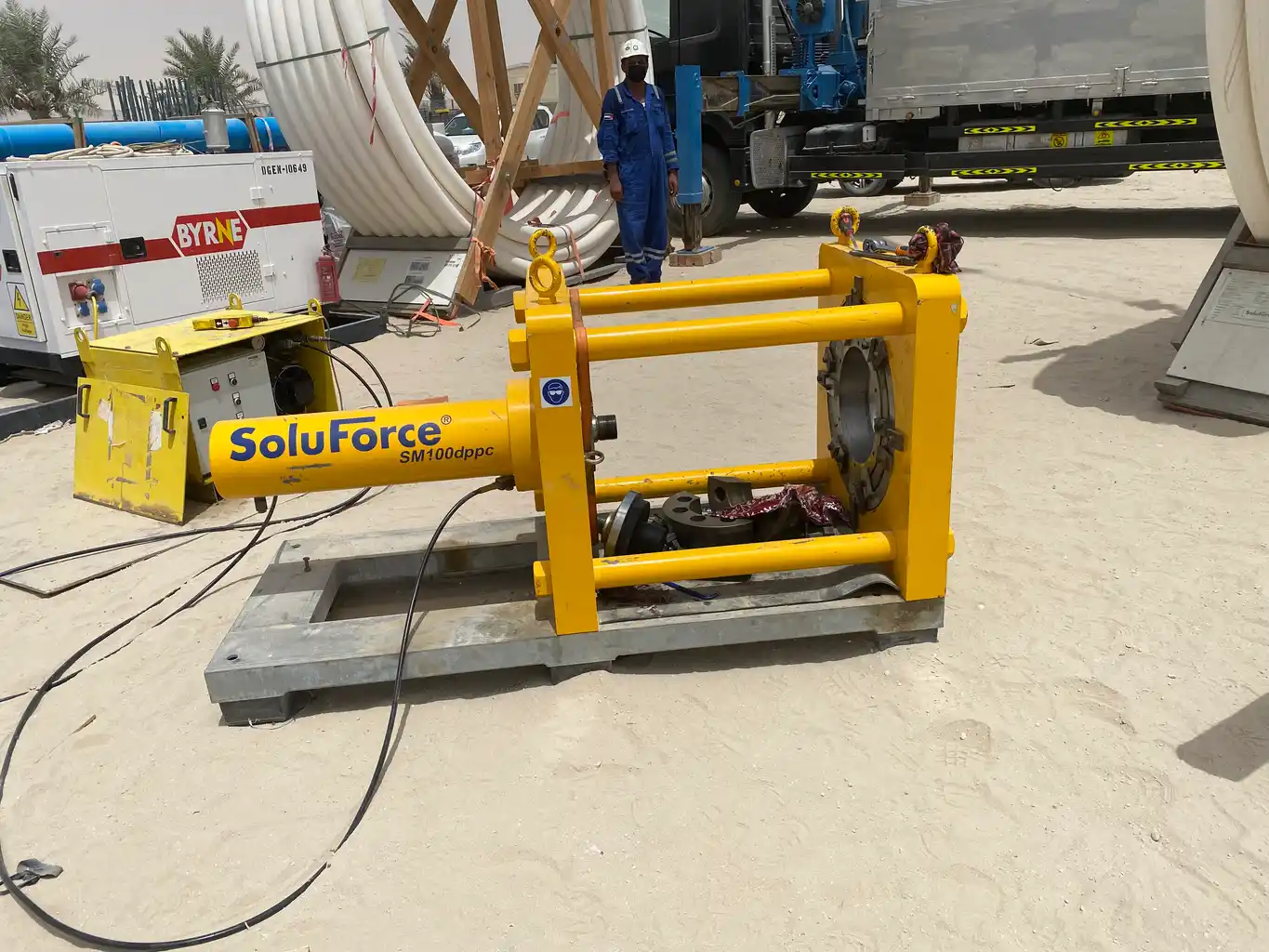 SoluForce yellow swage press machine on site